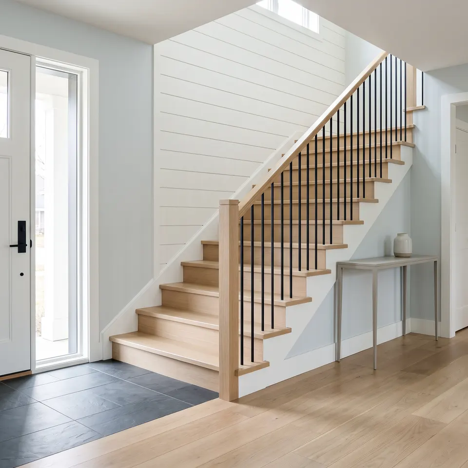 Clean entry hall and white-oak stairs in a Whatcom County home